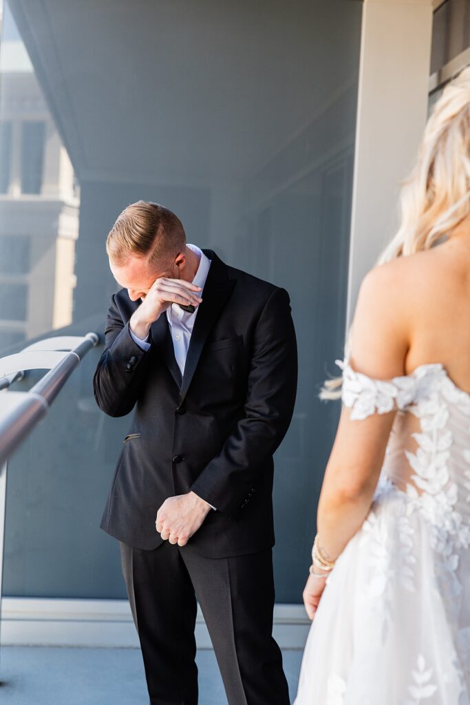 A groom has an emotional reaction to his first look at this bride before their Las Vegas elopement