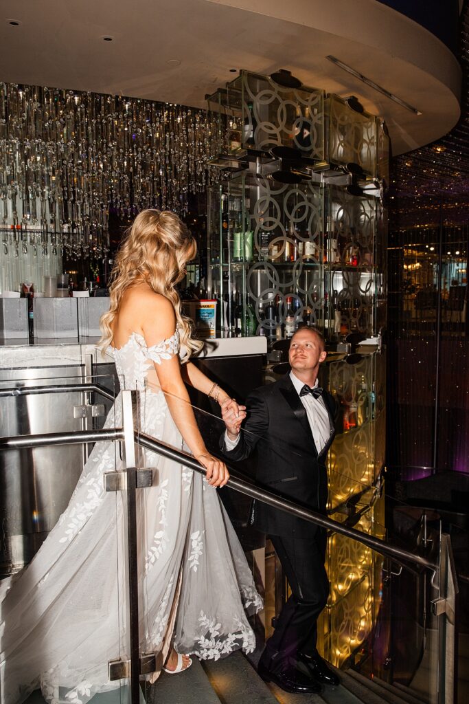 Newlyweds walk hand-in-hand for bridal portraits while eloping to Las Vegas