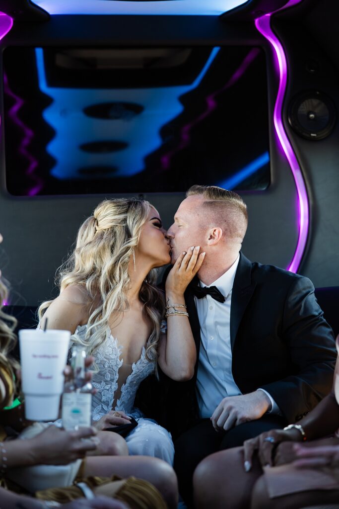 A bride & groom share a kiss on their way to their elopement in Las Vegas
