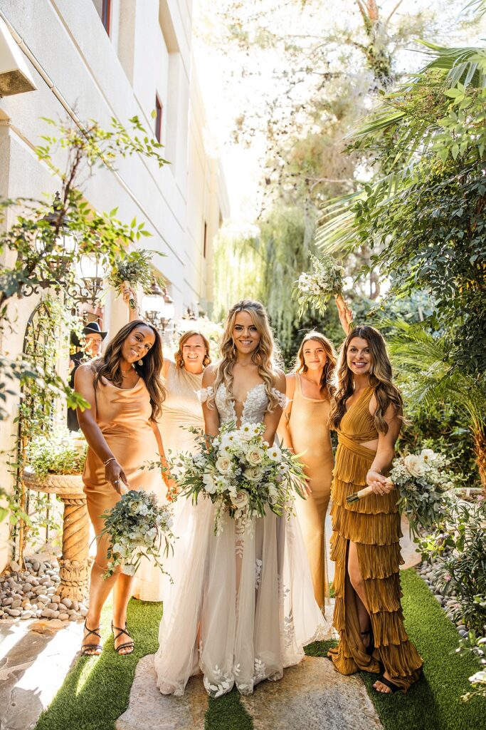 A bride poses with her bridesmaids after eloping to Las Vegas 